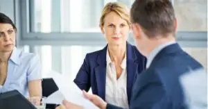 Business executives reviewing documents during a meeting in an office